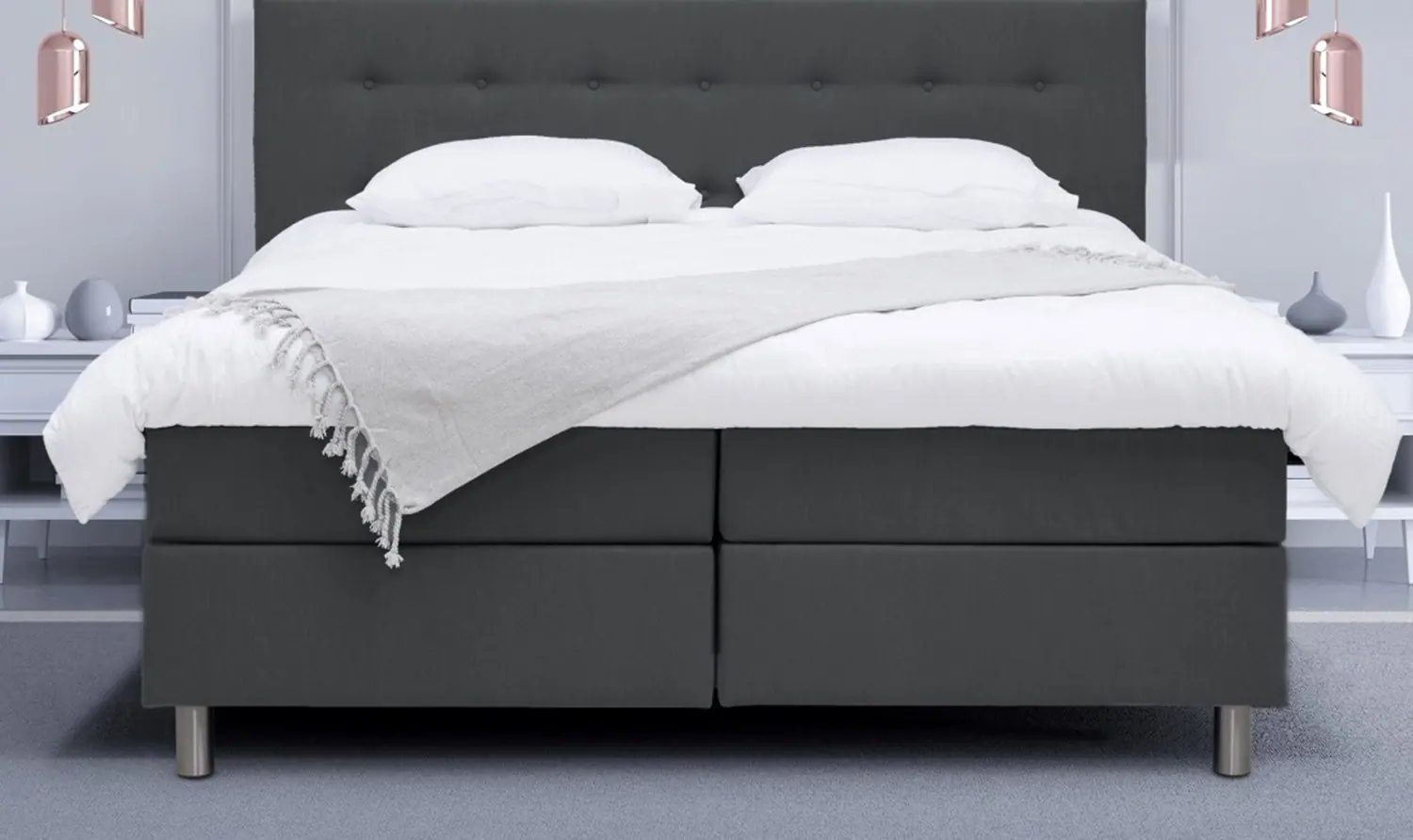 Boxspring in antraciet met wit beddengoed