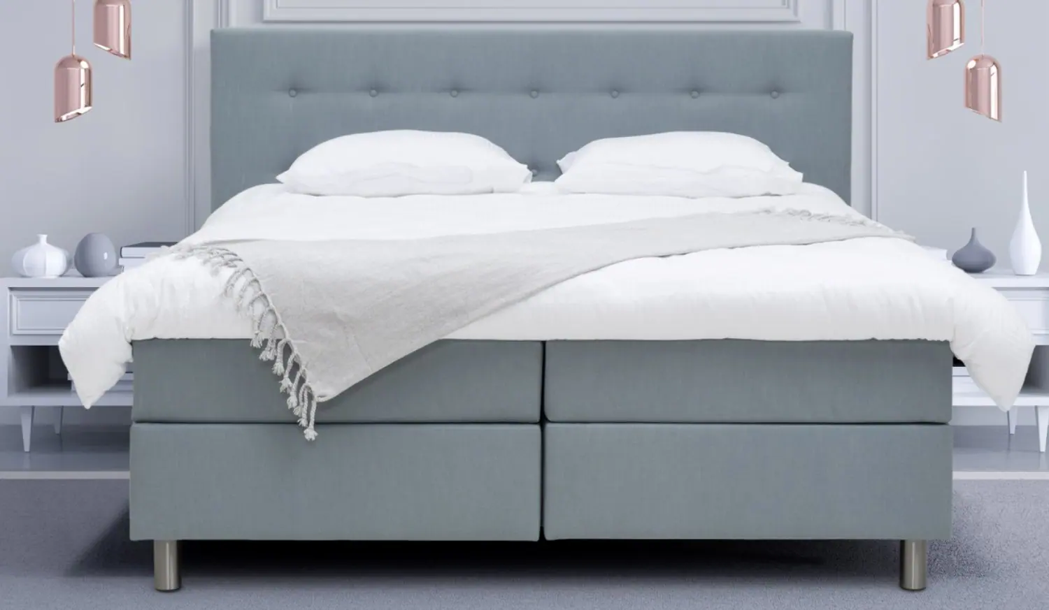 Boxspring in blauw met wit beddengoed